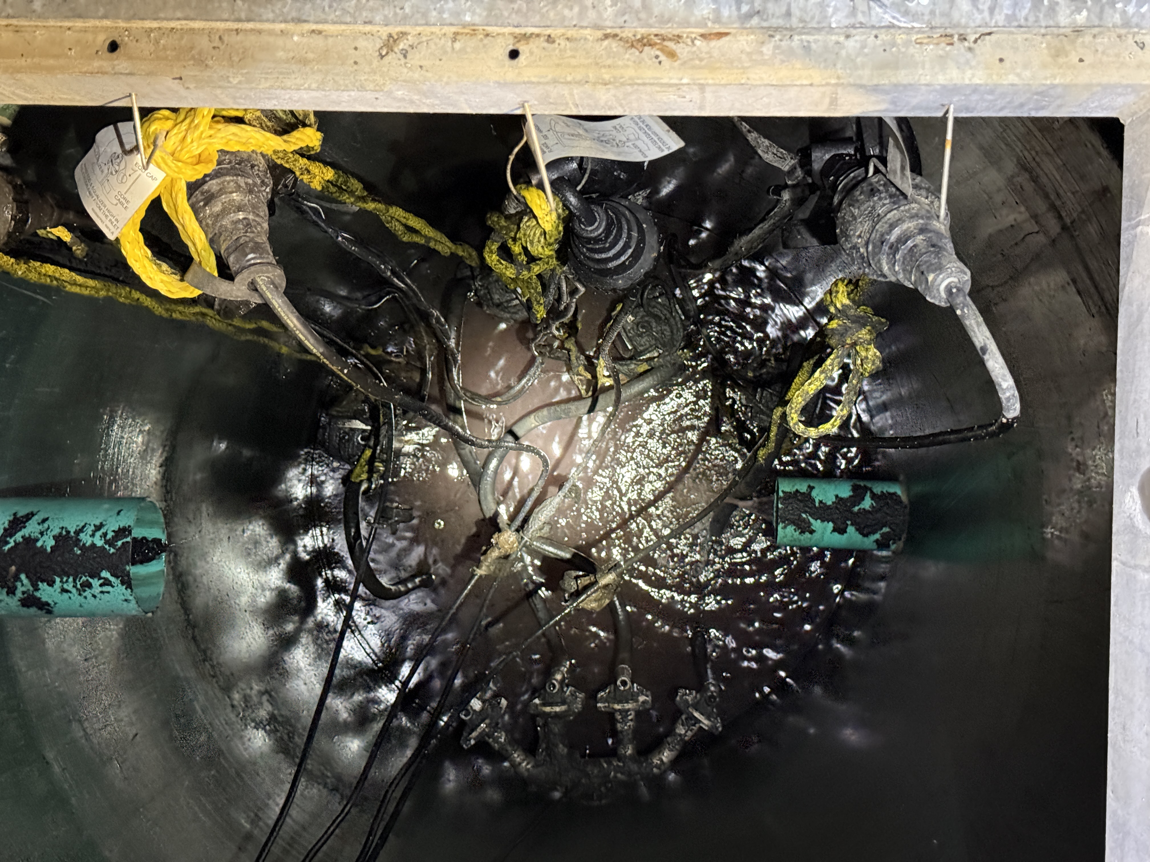 Close-up of lift station blockage and debris before vacuum truck cleaning