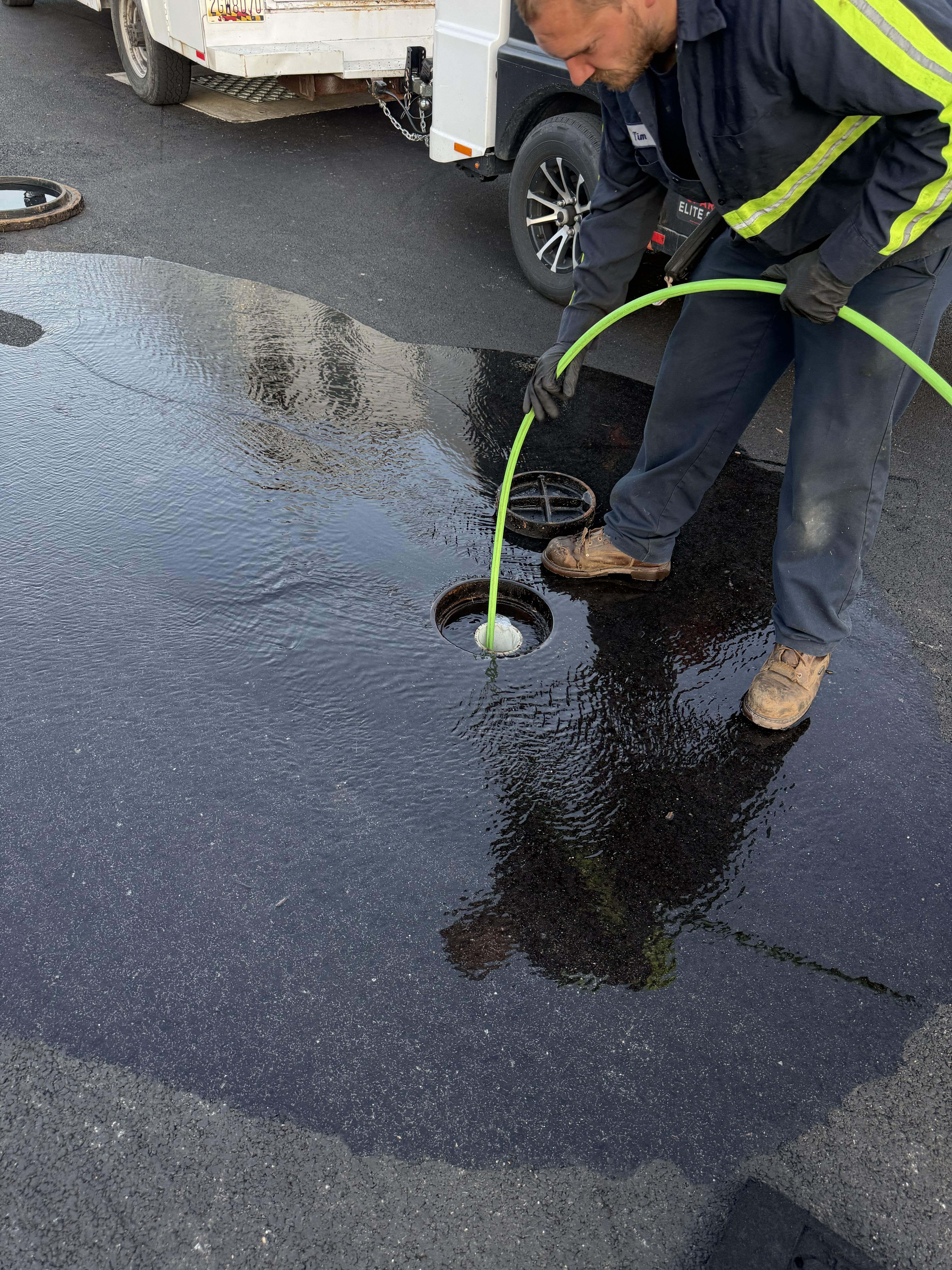 Terry hydro jetting the blocked drain line to clear the system