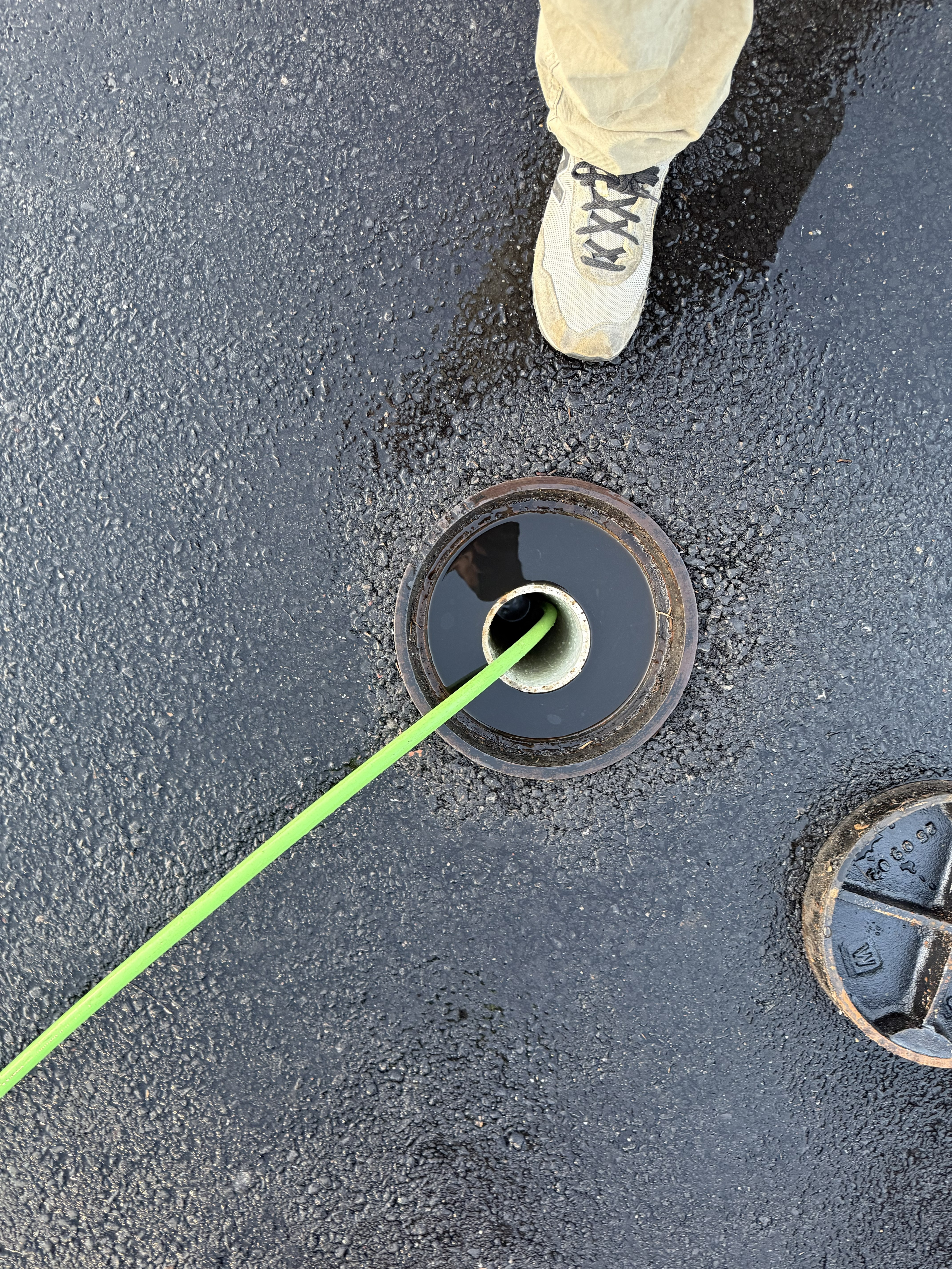 Clean drain after hydro jetting and test ball removal — system flowing correctly